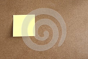 yellow post it paste on brown wood background have copy space for put text to do list