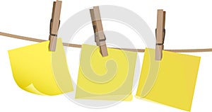 Yellow postit note on a peg on string