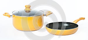 A yellow pot and pan on seamless white background