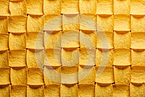 Yellow potato chips pattern geometric background