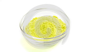 Yellow powder in bowl for playing Indian colorful festival