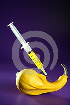Yellow pumpkin and syringe