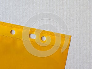 Yellow punched pocket