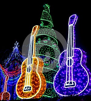 Yellow and Purple Guitars and Holiday Tree and Ornaments lit up