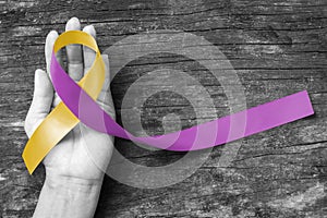 Yellow Purple ribbon raising awareness people life living with RA disease, World Autoimmune Arthritis Day photo
