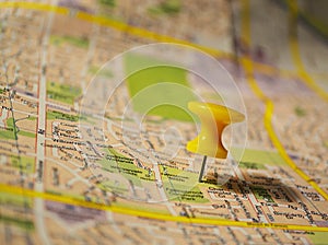 Yellow pushpin on a map
