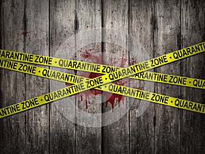 Yellow quarantine zone tape for warning over quarantine area on outbreak situation with bloody dirt wooden wall background