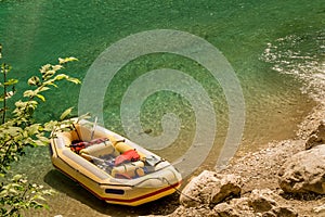 Yellow raft on a riverbank