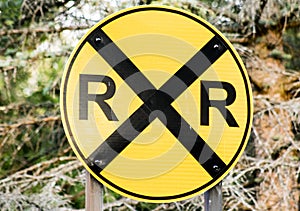 Yellow railroad crossing sign photo