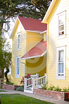 Yellow ranch house and white hand rail