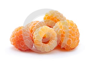 Yellow raspberry berries on white