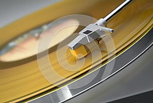 Yellow record on turntable