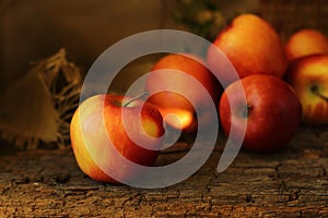 Yellow red apples are on a dark wooden background