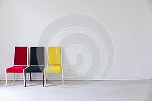 yellow red black chairs on white background interior
