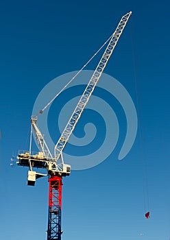 Yellow red and blue hoisting crane photo