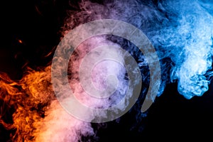 Yellow, Red, and Blue Plume of Smoke Breaking Apart over a Black Background