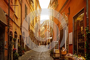 Yellow and red bright houses on narrow traditional streets of an Italian town.