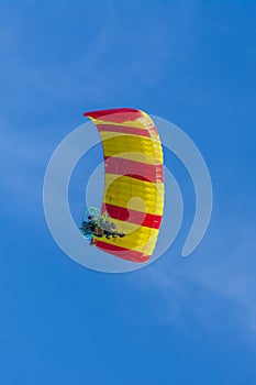 Yellow and red canopy powered tandem para glider