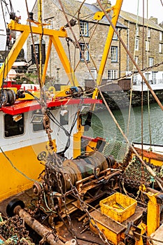 Yellow and Red Fishing Boat Moored in Polperro Harbour, Cornwall