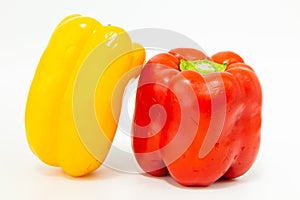 Yellow and red fresh bell peppers, on white background