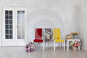 yellow red grey chair with flowers on white background interior in bright room