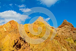 Yellow and red mountain in Asia at rock formation erosion valley