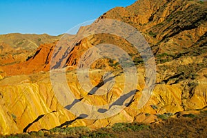 Yellow and red mountain in Asia at rock formation erosion valley