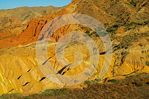 Yellow and red mountain rock formation valley