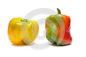 Yellow and red paprikas isolated on white