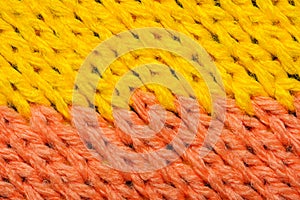 Yellow and red synthetic knitted fabric texture