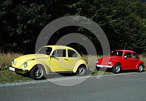 Yellow and red vw beetles