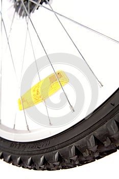 Yellow reflector on bike wheel