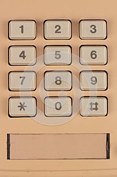 Yellow retro push-button phone