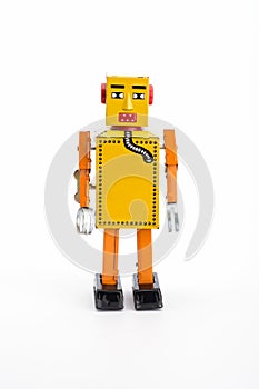 Yellow retro toy robot.