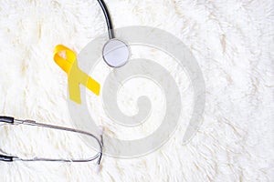Yellow Ribbon and Stethoscope on white background for supporting people living and illness. September Suicide prevention day,