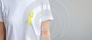 Yellow Ribbon for supporting people living and illness. September Suicide prevention day, Childhood, Sarcoma and bone cancer