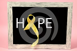 Yellow ribbon symbolic color for Sarcoma Bone cancer awareness and suicide prevention