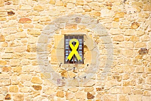 Yellow ribbon hanging out of a building in Catalonia photo