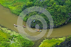 Yellow rice field on Ngo river in Tam Coc Bich from mountain top view in Ninh Binh