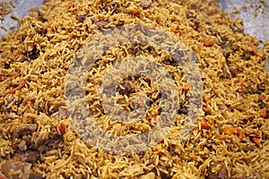 Yellow rice. Palaw with meat and spices in big pan