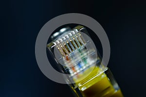 Yellow RJ-45 or ethernet internet cable close-up