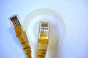 Yellow RJ-45 or ethernet internet cable on white background