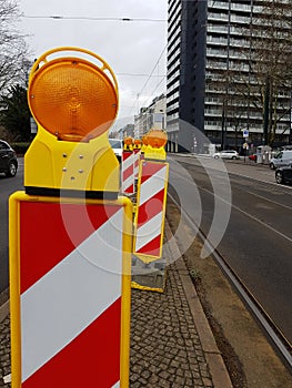 Yellow road dividing columns with reflectors