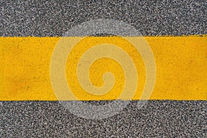 Yellow road marking line, top view as design element and copy space