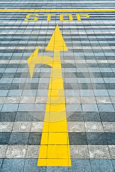 Yellow road marking on pave