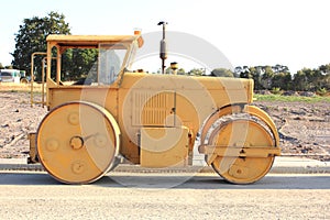 Yellow road roller machine