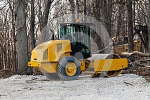 yellow road-roller on repairing of the road