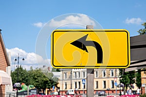 Yellow road sign for bypass with arrow