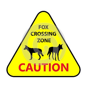 Yellow road sign: Fox Crossing Zone. Drive slowly for animal safety.