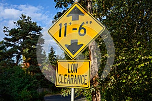 Yellow road sign, Low Clearance of 11â€™ 6â€, caution to tall vehicles